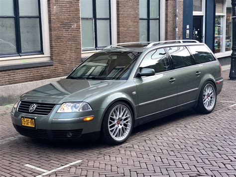 The sleek profile of a Volkswagen Passat Variant (B5.5) in a modern urban setting, highlighting its elegant design and spacious look
