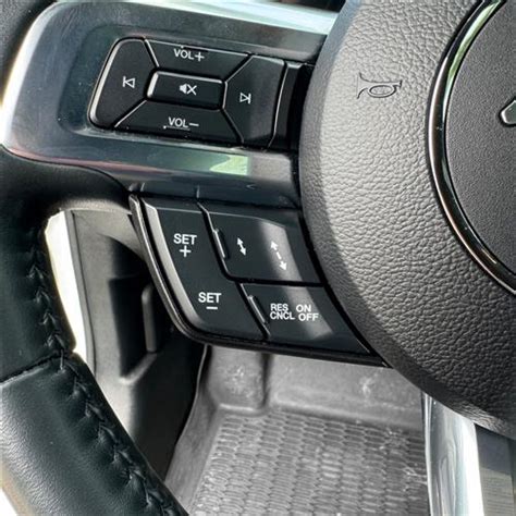 Thematic photo of the interior of a Ford Mondeo with cruise control buttons on the steering wheel