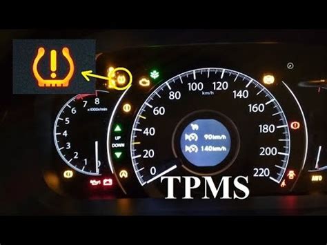 Thematic photo of Honda CR-V interior with TPMS warning light on dashboard