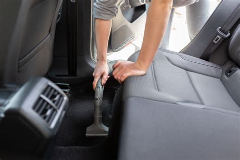 Photo of a car interior being vacuumed