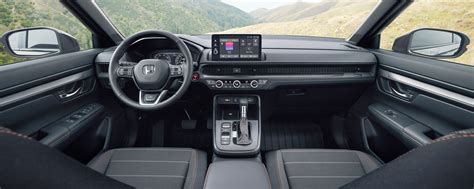 Interior view of Honda CR-V, showing dashboard, seating, and multimedia screen