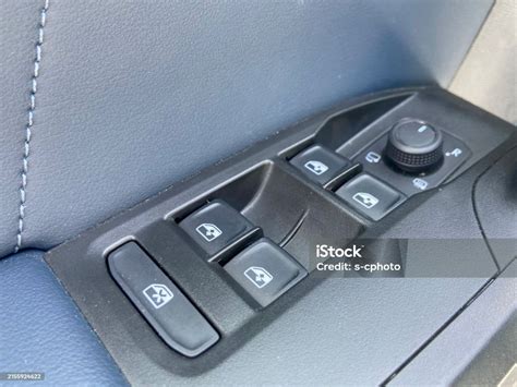 The interior of a Mercedes-Benz W639 with a close-up on the window control panel and buttons.