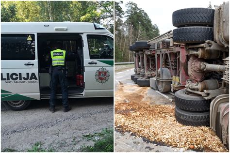 Policijos automobilis ir apvirtęs vilkikas po avarijos