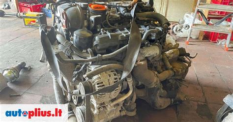 Audi 100 (1985 m.) variklio skyriaus schema su pažymėtu paskirstymo diržu