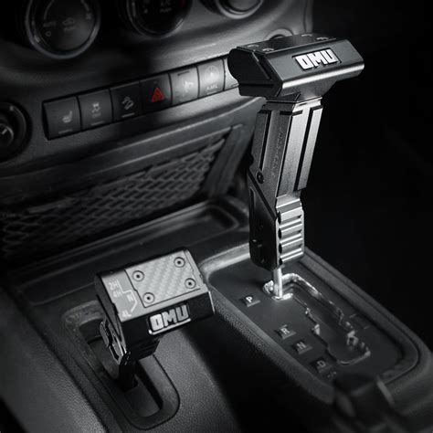 Detailed photo of a mechanical gear lever with a visible blocker button