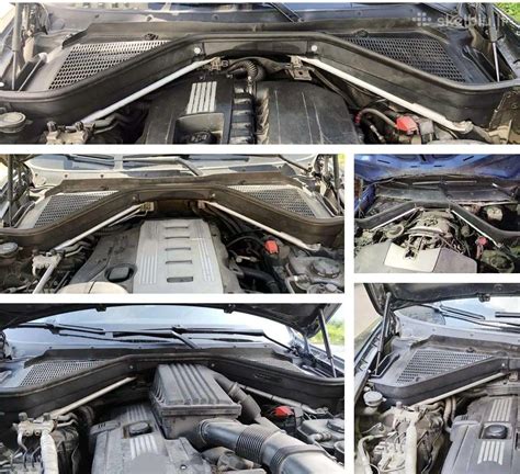 BMW E39 variklio skyriaus apatinės dalies nuotrauka su tepalo nuotėkio pėdsakais