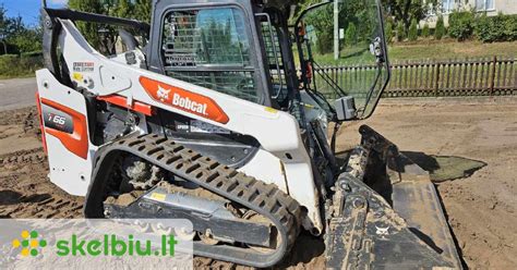 Tematinė nuotrauka: Vikšrinis Bobcat krautuvas su planiravimo kaušu