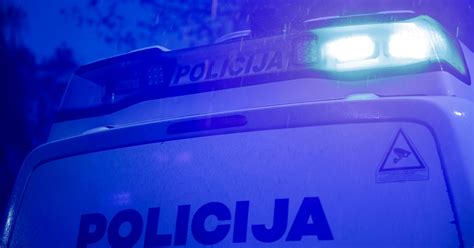 Policijos automobilis su užrašu 