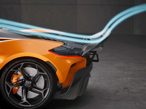 Detailed close-up photo of the McLaren Speedtail's rear active aerodynamic elements, showing the seamless integration of the ailerons into the carbon fiber body panel.