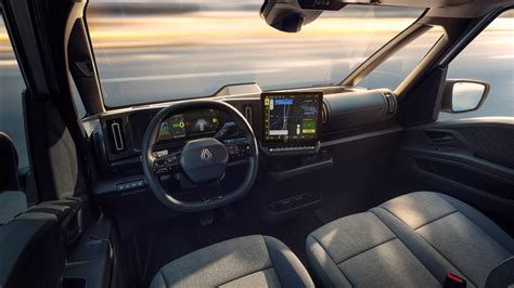 Vaizdas, vaizduojantis „Renault Trafic E-Tech electric“ interjerą su 10 colių skaitmeniniu prietaisų skydeliu ir 12 colių centriniu ekranu.