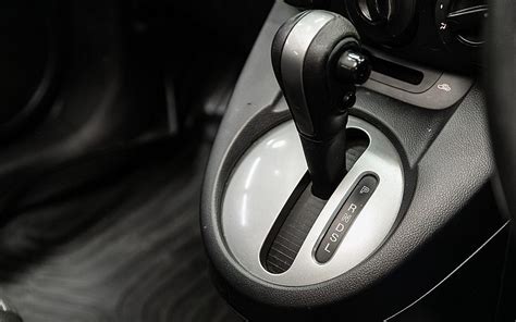 Thematic photo of a car interior with an automatic gearbox lever