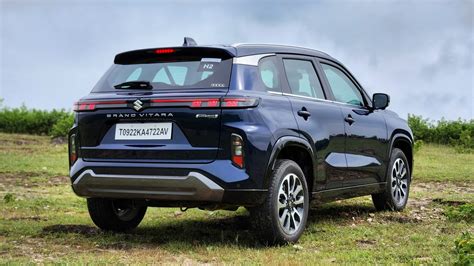 Thematic photo of a Suzuki Grand Vitara on a road, perhaps with a scenic background