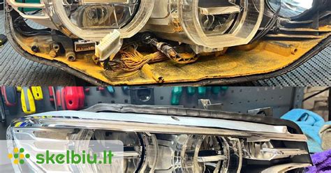 Nuotrauka, vaizduojanti automobilių mechaniką, atliekantį žibintų reguliavimą.
