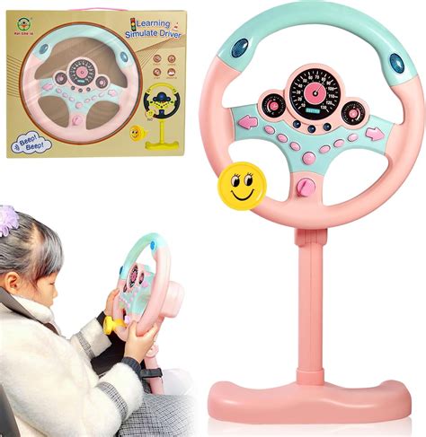 Child playing with a toy steering wheel in a car