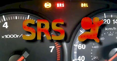 Photo of a car dashboard with a lit SRS warning light