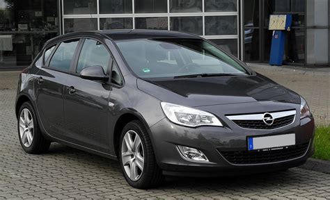The Opel Astra J in a dynamic urban setting.