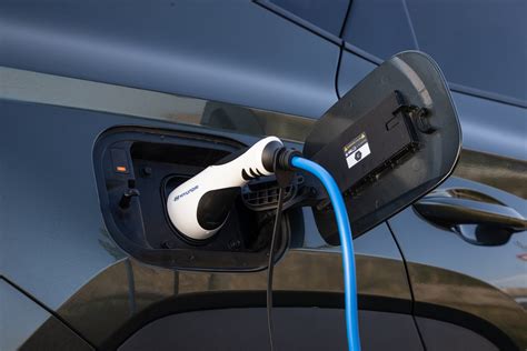 schema of charging a plug-in hybrid car at home and at a public station