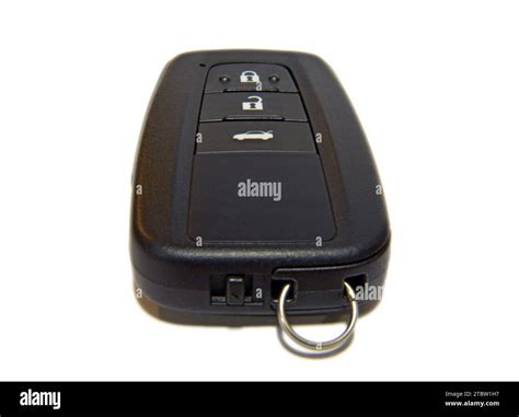 Thematic photo of a car key with central locking buttons