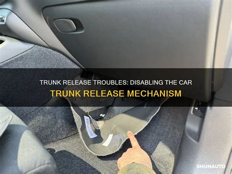 Location of an emergency release mechanism in a car trunk