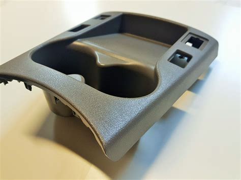 BMW E60 centrinės konsolės ir ortakio išmontavimo detalių schema