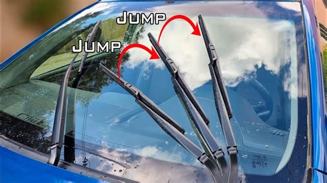 Thematic photo of a car's rear wiper in action during rain