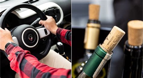 Nuotrauka su automobilio salonu, kuriame keleiviai galimai vartoja alkoholį