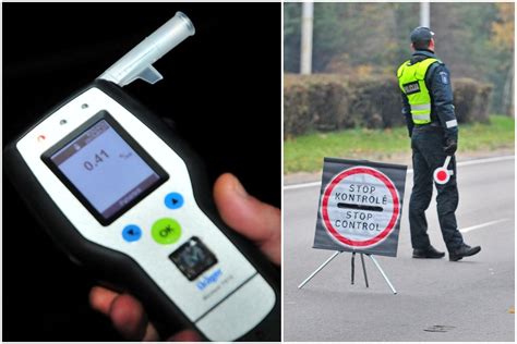 policijos pareigūnas, tikrinantis vairuotojo blaivumą alkotesteriu