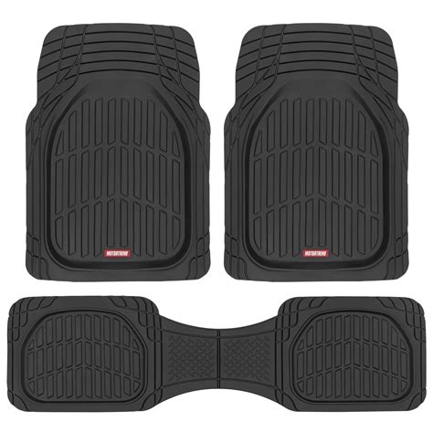 Close-up of a rubber car floor mat showing the reinforced driver's heel pad and raised edges.