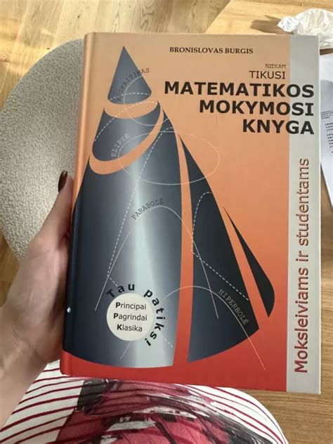Tematinė iliustracija su KET knyga ir mokymosi medžiaga