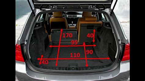 The trunk of a BMW 3 Series E91 Touring with a precisely fitted rubber mat